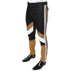 A pair of Dolce & Gabbana multicolor striped trousers with a black, white, and brown design, featuring a flat front and slim fit.