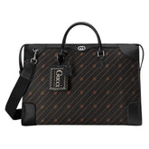 A black Gucci satchel bag with Interlocking G fabric jacquard and leather details, featuring a top handle and a detachable strap.