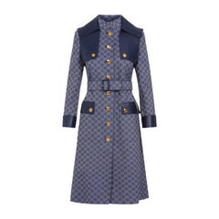 Patterned coat with navy accents on a light gray background