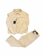 Beige winter coat with matching pants on a white background