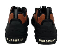 Black and brown Burberry sneakers on a white background