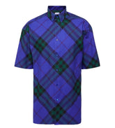 Blue and green plaid shirt on a light gray background