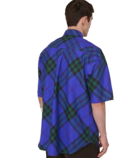 Person wearing a blue and green plaid shirt on a white background