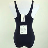 Black swimsuit on a mannequin with Chanel branding.