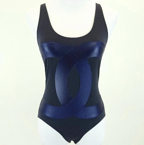 Black and blue swimsuit on a mannequin against a white background