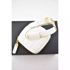 White dog collar with gold hardware on a black background