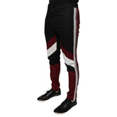 A pair of Dolce & Gabbana multicolor striped skinny cotton trousers with a button and zip closure, featuring a flat front design, side pockets, and a mid-rise waist.