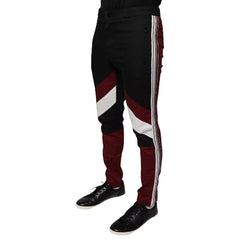 A pair of Dolce & Gabbana multicolor striped skinny cotton trousers with a button and zip closure, featuring a flat front design, side pockets, and a mid-rise waist.