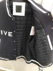 Black quilted jacket with white lettering on a white background