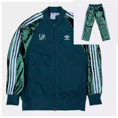 Green tracksuit with Adidas logo and 'Korn' branding on a white background