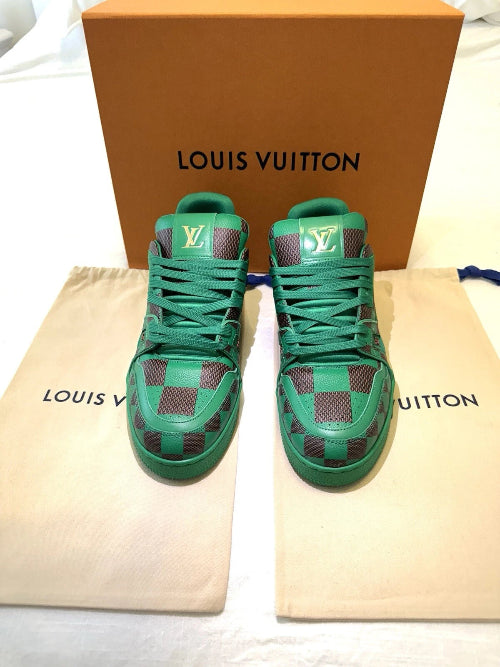 Green high-top sneakers with checkered pattern on a Louis Vuitton dust bag and box.