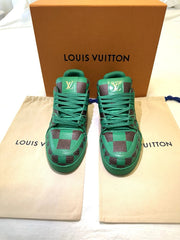Green high-top sneakers with checkered pattern on a Louis Vuitton dust bag and box.