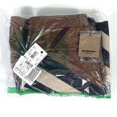 Packaged Burberry scarf with tags on a white background