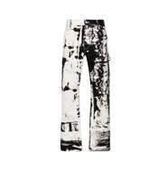 Black and white abstract patterned pants shown against a plain white background.