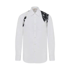 A white long-sleeve button-up shirt with black and gray abstract graphic patterns on the right shoulder and sleeve, shown on a plain white background.