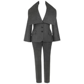A dark gray two-piece suit with a wide lapel blazer jacket and matching trousers, shown against a plain white background.