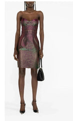 Model wearing a strapless dress with a geometric pattern on a white background