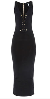 Black dress with gold zipper details on a white background