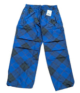 Blue pants with black patterns on a plain background