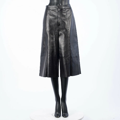 Black leather skirt on a mannequin against a white background