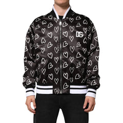 Black jacket with white heart pattern and visible brand logo on a white background