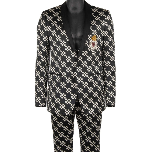 Black and white checkered suit with a decorative patch on a mannequin against a white background
