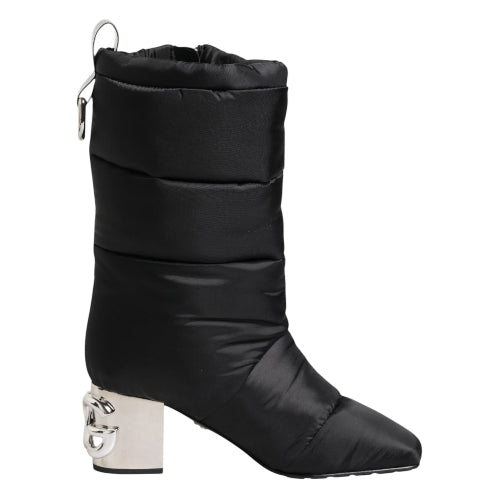 Black puffer boot with a unique heel design on a white background