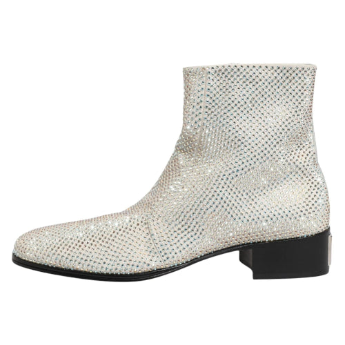 A single silver snakeskin-textured ankle boot with a low black block heel, shown from a side profile on a white background.