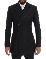 Black double-breasted coat worn by a person on a white background
