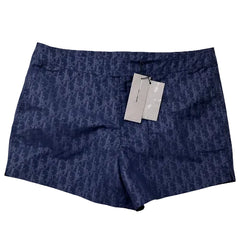 Blue shorts with a pattern and tags on a white background