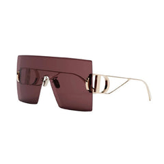 Sunglasses with gold frame and maroon lenses on a white background