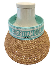 Woven coaster with 'Christian Dior' branding on a white background