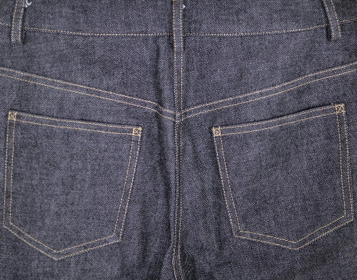 Close-up of blue denim jeans with stitching details