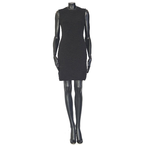 Black dress on a mannequin against a white background