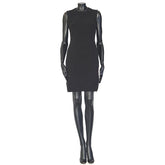 Black dress on a mannequin against a white background