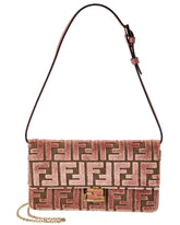 Pink patterned handbag with a chain detail on a white background