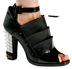 Black high-heeled sandal with open toe on a white background