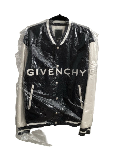 Black Givenchy jacket on a hanger with clear plastic wrap.