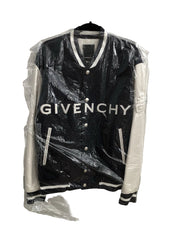 Black Givenchy jacket on a hanger with clear plastic wrap.