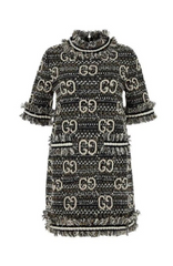 Black and white patterned dress with a collar on a plain background