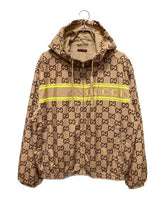 Beige Gucci jacket with logo pattern on a white background