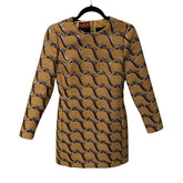 Patterned dress on a hanger with a visible brand label against a white background