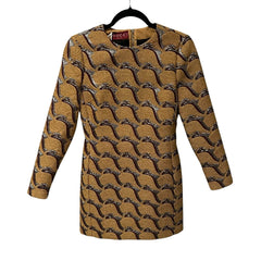 Patterned dress on a hanger with a visible brand label against a white background