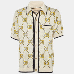 Beige shirt with Gucci logo pattern on a white background