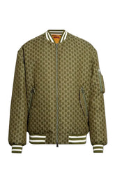 A bomber jacket featuring an all-over olive green and brown monogram pattern, with striped ribbed collar, cuffs, and hem, and zippered pockets.