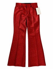 Red textured wide-leg trousers with a metallic sheen, shown flat against a white background with a white brand tag attached.