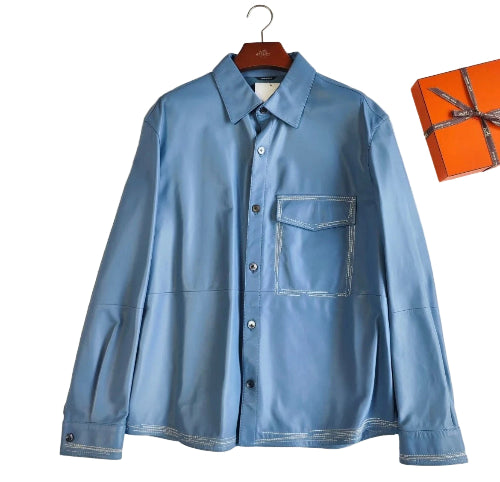 Blue shirt on a hanger with an orange box in the background
