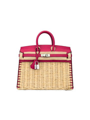Pink and beige handbag with wicker design on a gray background