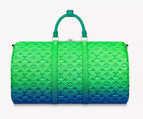 Green and blue gradient duffel bag with monogram pattern on a white background