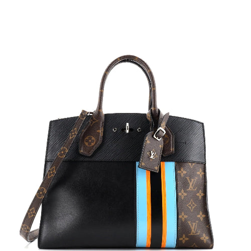 Designer handbag with monogram pattern and colorful stripes on a white background